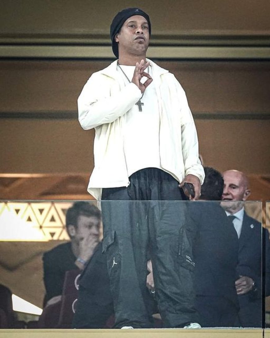 Brazil's Ronaldinho is enjoying Argentina's goal while sitting in the gallery