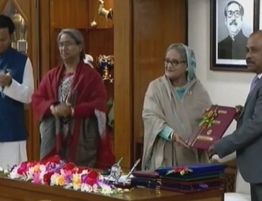 Handing over copy of HSC result to Prime Minister